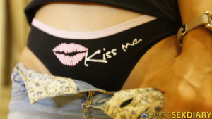 Flashing panties with Kiss Me and lips on it