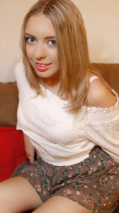 Big eyed Daniela in skirt and white top