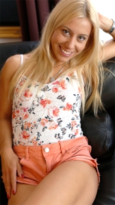 Sexy young blonde MILF Agnes poses in shorts
